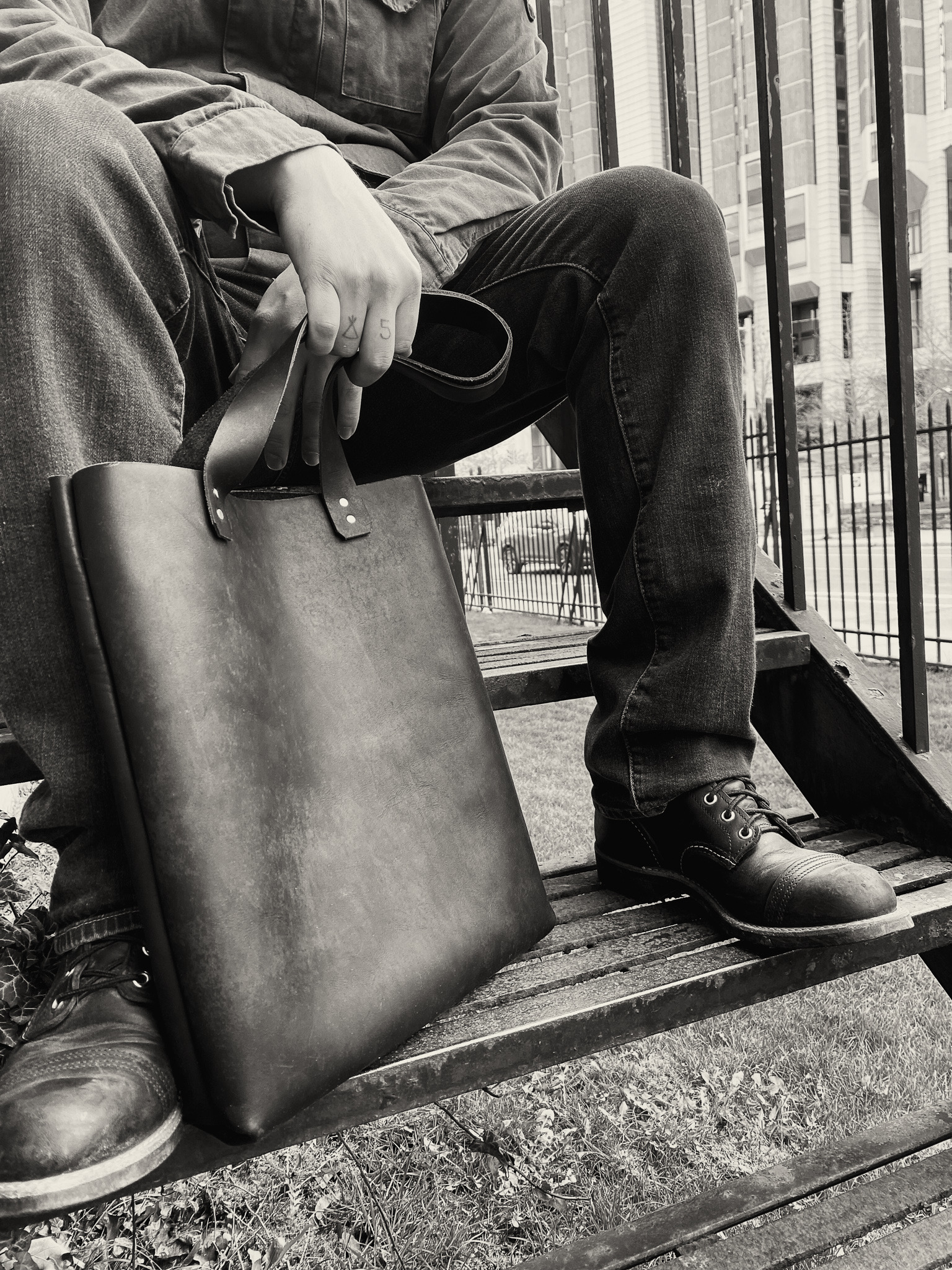 black and white photo of a leather bag